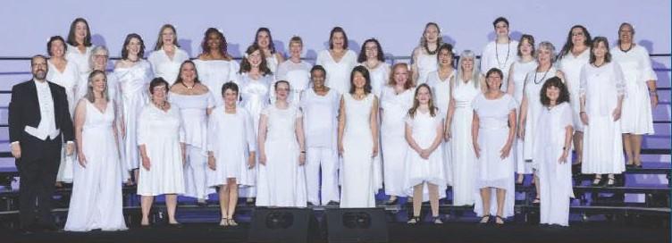 Bella Nova Chorus on stage in white
